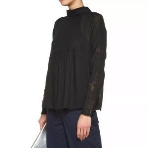Black tibi top with crochet sleeve details size M
